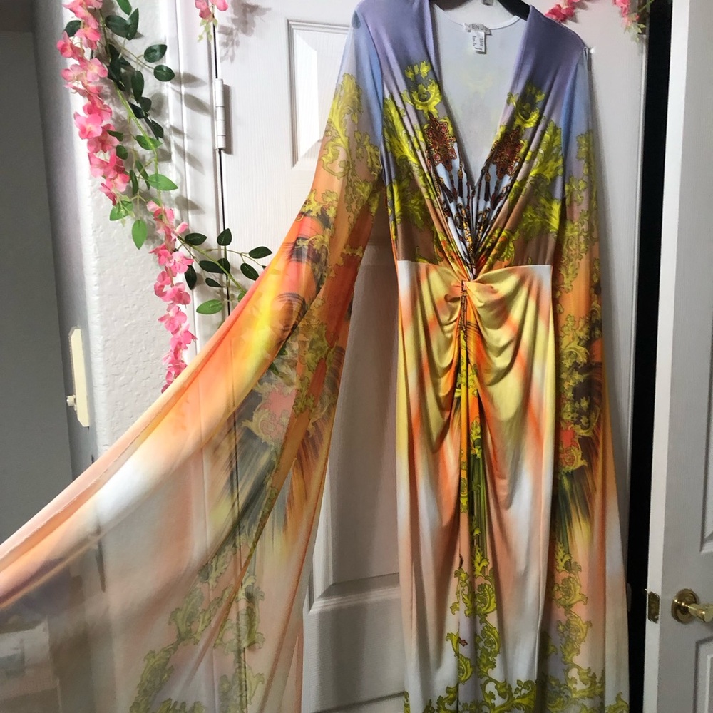 Vacation dress!! Arms are long sleeve & cut out. Body is form fitting